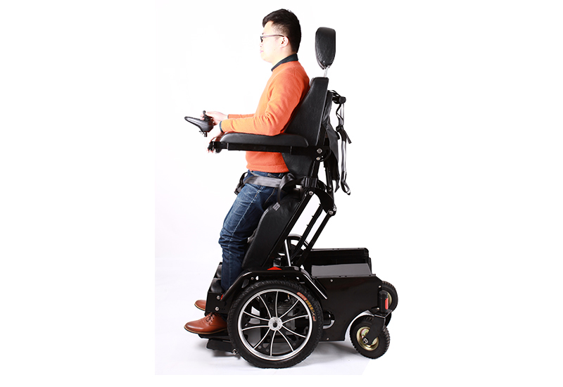 Sit to stand manual wheelchair